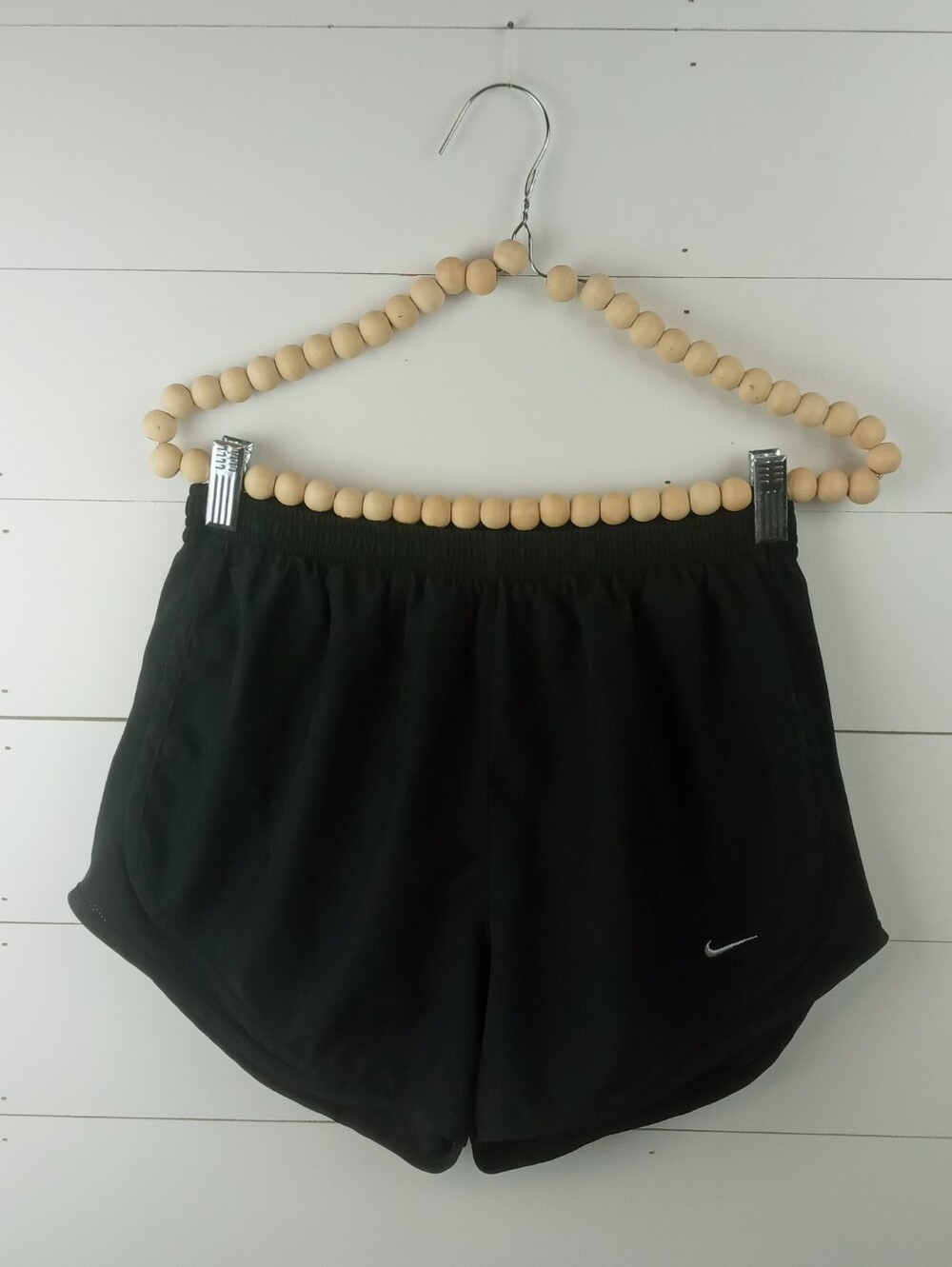 Nike Women's size M black elastic waist athletic shorts lined white logo